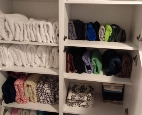 towel closet organized after
