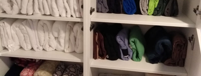 towel closet organized after