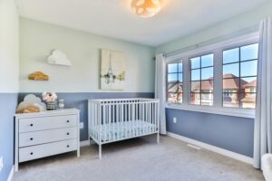 Blue nursery as illustration of best practices for organizing a new baby's room
