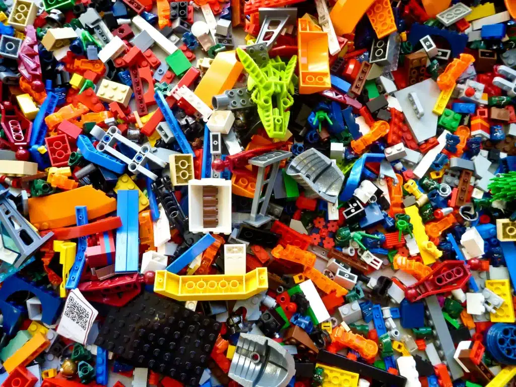 Kid-friendly Toy Organization - Get Ready for New Christmas Toys by Making Organizing Fun! 4 a pile of colorful lego blocks - Illustration for toy organization article
